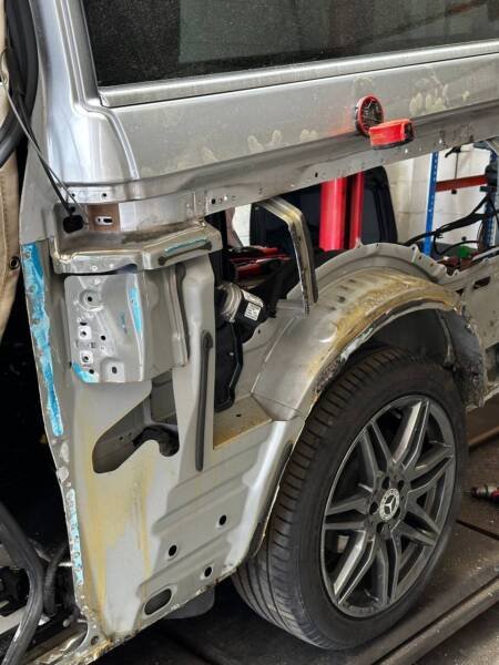 Accident repair workshop – Mercedes van rear quarter structure exposed for repair