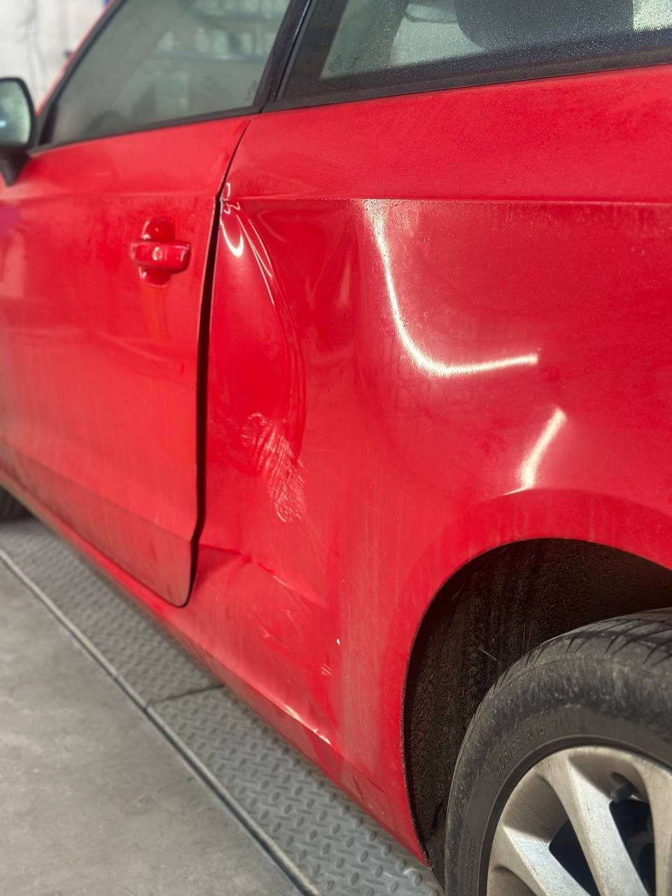 Rear quarter panel dent before repair and respray at Dent Dynamics