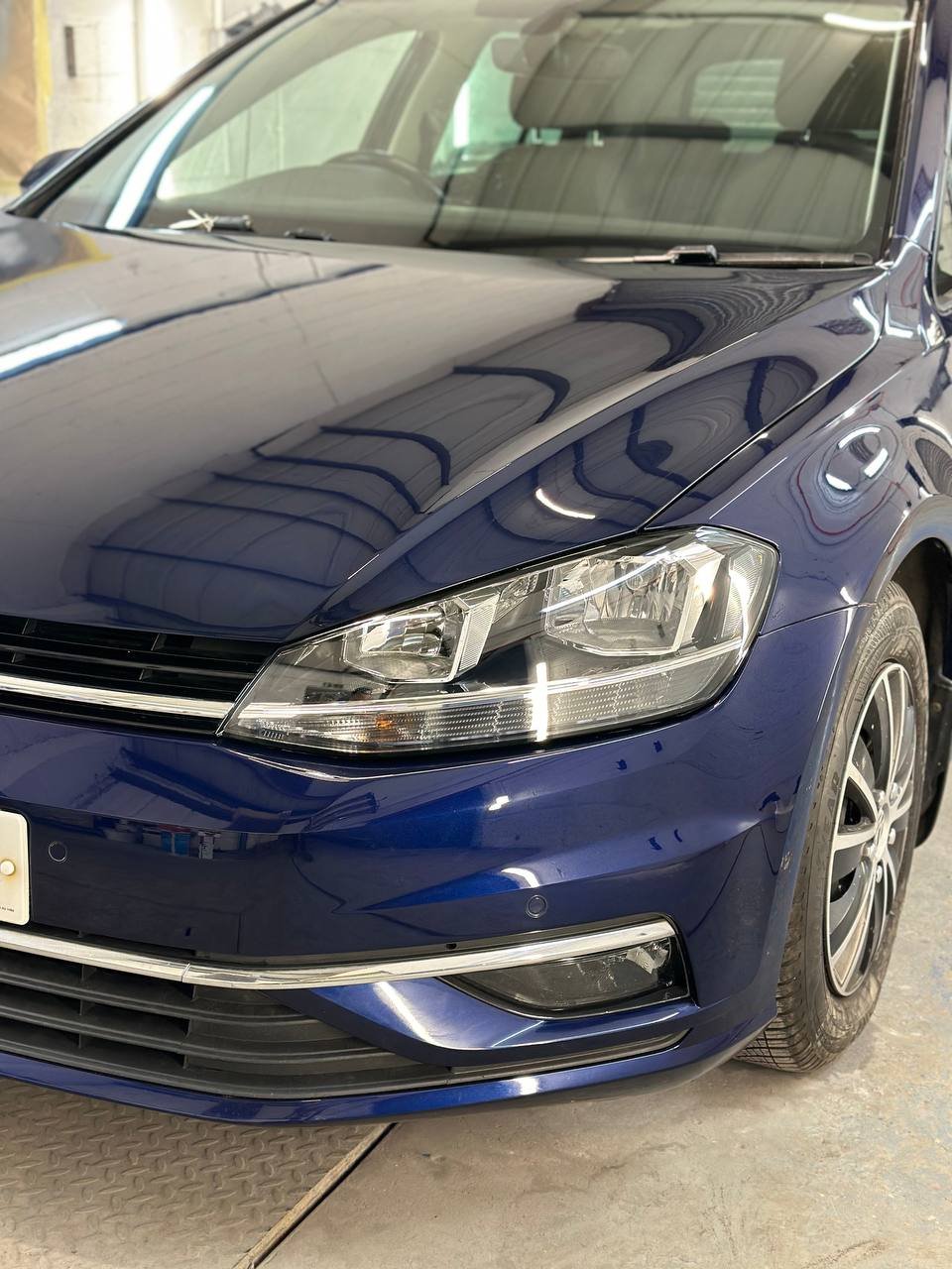 Front driver-side fully restored with new paint and panel alignment by Dent Dynamics