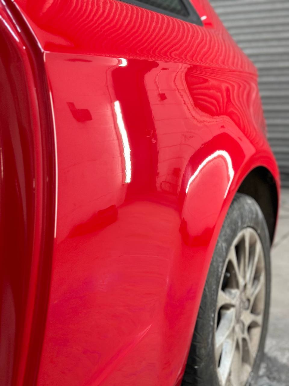 Repaired and resprayed quarter panel with smooth finish at Dent Dynamics