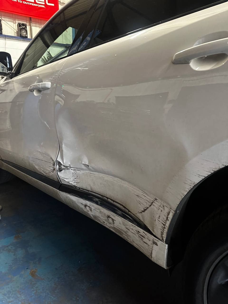 Damaged rear passenger door massive dent, needs paint job, before repair at Dent Dynamics Burton-on-Trent