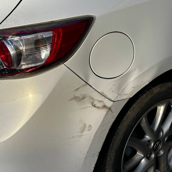 Rear quarter panel dent and scratches before car body repair Burton-on-Trent