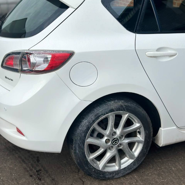 Car body repair Burton-on-Trent – repaired rear quarter panel on white Mazda